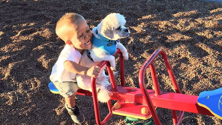 Boy and Dog With Dwarfism 3