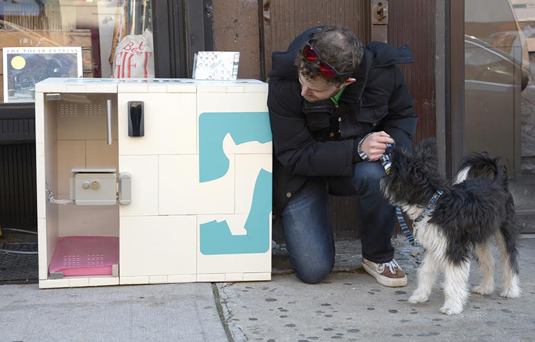 Dog Parker.PICTURED Eric Abis pictured with his pouch "Bernie" outside Fort Greene General Store at 218 Dekalb avenue (he plans to use it in near future).Pet owners who are averse to tying their dogs outdoors while running errands have a novel option in Brooklyn: "parking" their dogs in sidewalk containers outside retail stores. The "dog parker" program, which launched as a pilot in Brooklyn last month, is run through an app that charges 20 cents per minute - or $12 for an hour.Users can call dibs on an insulated kennel 15 minutes ahead of time in order to buy groceries or enter other stores where dogs are forbidden -- without having to walk all the way home first. The containers are lockable via radio frequency, monitored by web cams and temperature controlled unless the mercury dips below freezing. The firm launched a 10 kennel pilot in October with 50 users. It's not clear if the pilot had expanded yet or is still ongoing with two locations in Fort Greene, Brooklyn NYC.First outside Baguetteaboutit coffe shop at 270 Vanderbilt avenue and the other block away Fort Greene General Store at 218 Dekalb avenue.