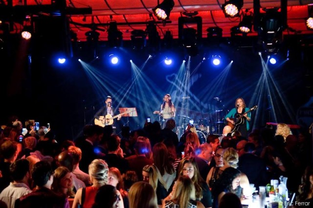 A Rock & Rawhide concert gathers a lively crowd of people.