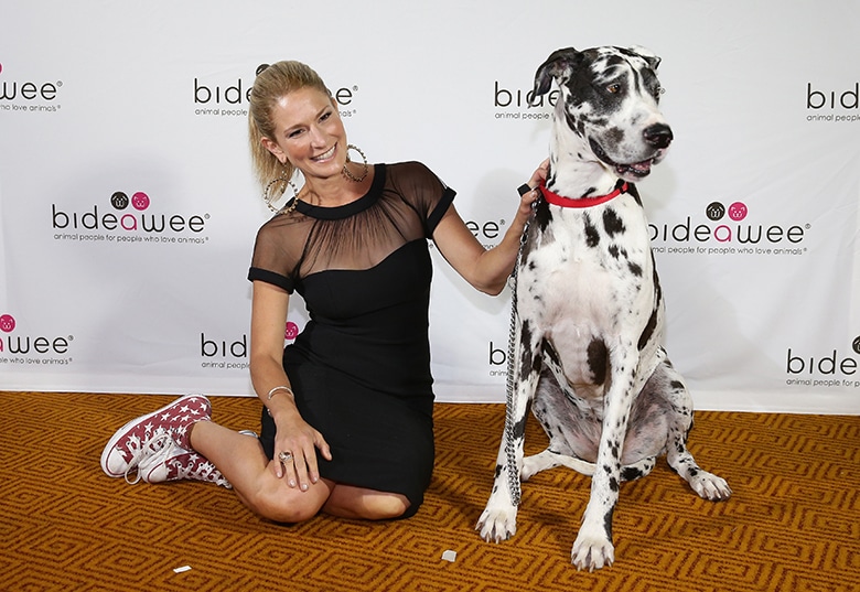 A woman posing with a dalmatian at an Upcoming Ball to raise money for Bideawee.