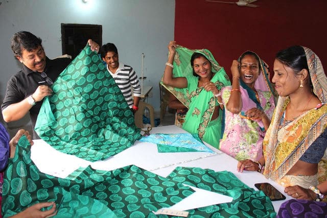 A group of women working on a Key's Apparel fabric.