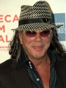 Mickey Rourke, a man wearing a hat and sunglasses.