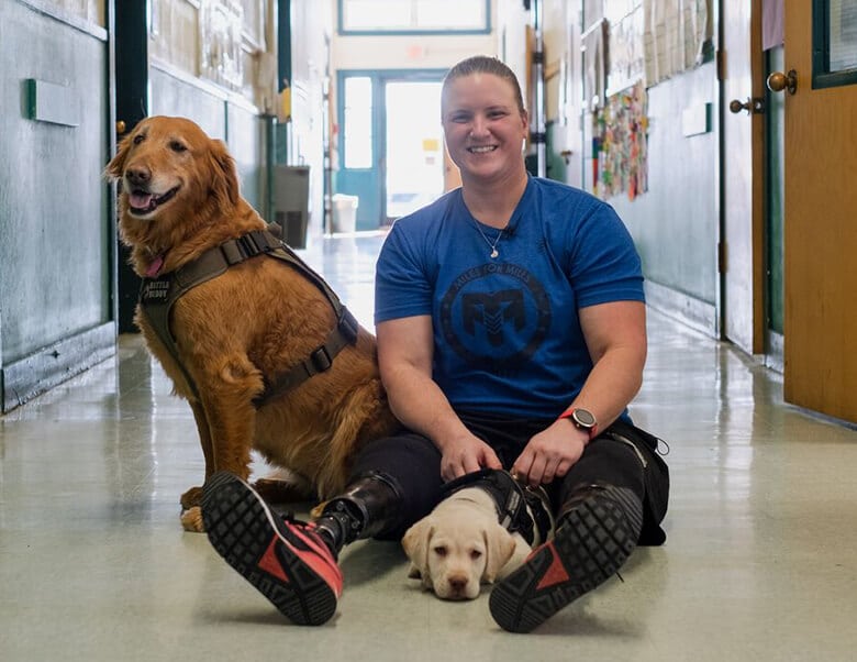 Woman Who Lost Both of Her Legs Trains Disabled Puppy to Be a Therapy Dog