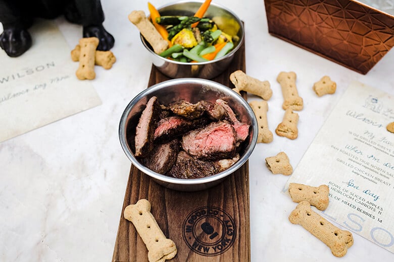 A plate of steak on a table, suitable for a steak dinner at a restaurant.