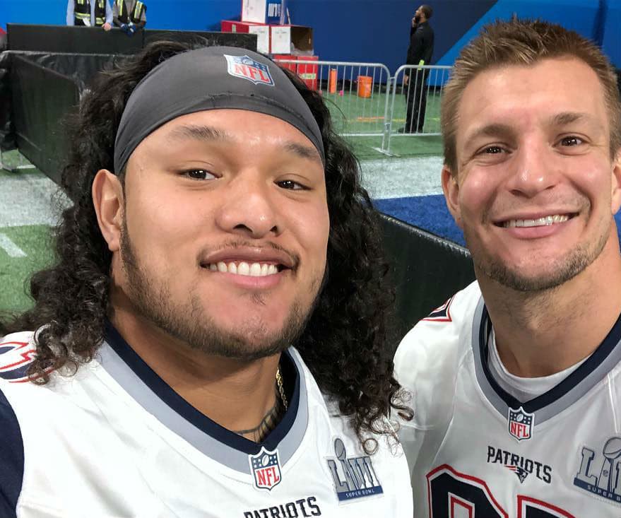 Two NFL players posing for a photo.