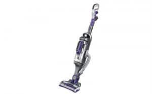 A black and purple vacuum cleaner designed for pet hair on a white background.
