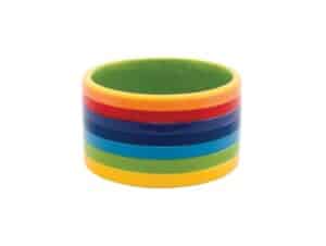 A stack of colorful Pride Essentials for Dog bangles on a white background.